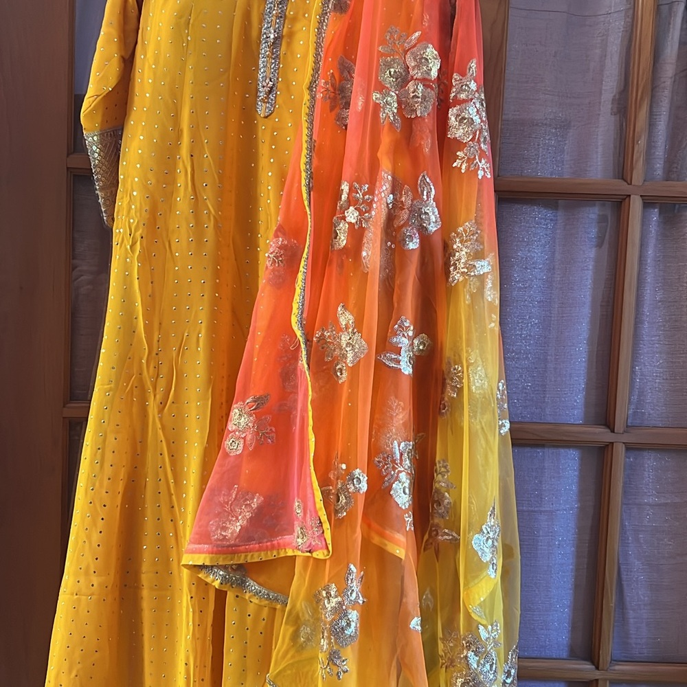 Yellow Embellished Anarkali gownwith sequin border and work on dupatta